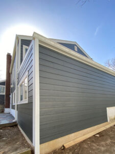 angled view of home with blue James Hardie siding