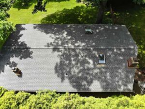 Overhead view of shaded section of roof with asphalt shingles in Dobbs Ferry
