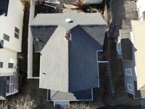 Aerial view of home with dark gray asphalt shingles