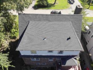 aerial view of home with asphalt shingle replacement