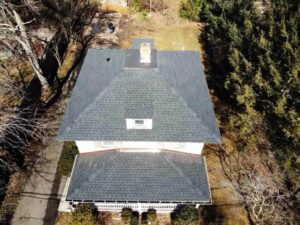 Overhead view of home with gray shingle replacement