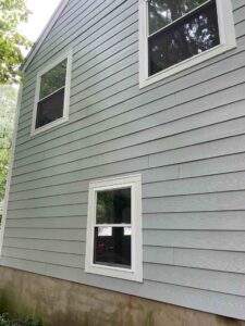 Back of home with Harvey windows replacement on home in Cos Cob