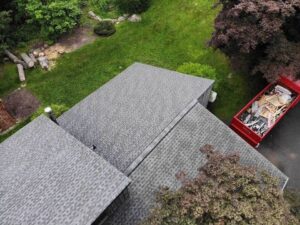 Aerial view of section of roof with gray GAF asphalt shingles 