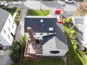 Aerial view of white home in White Plains, NY with new GAF Asphalt shingles