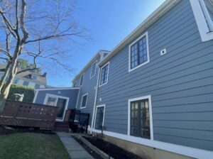 Back view of home with blue James Hardie siding