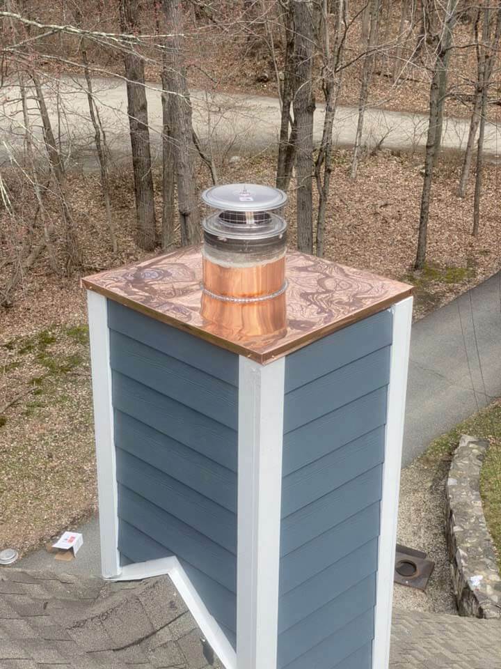 Chimney with James Hardie siding and copper cap