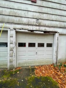 Damage to wood above garage door