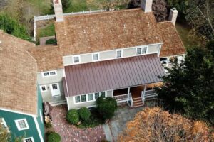 Aerial view of metal and wood roof on home