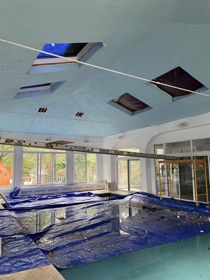Interior view of home with pool and skylights
