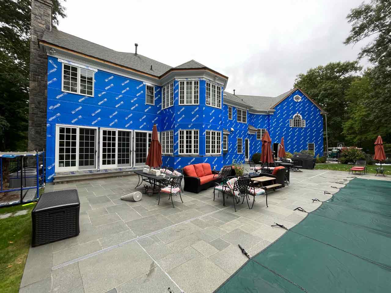 blue house wrap on home