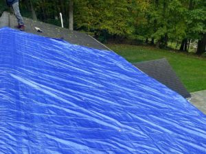 Blue tarp covering roof
