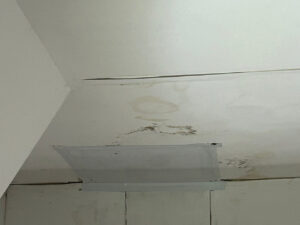 Discoloration on ceiling caused by roof leak