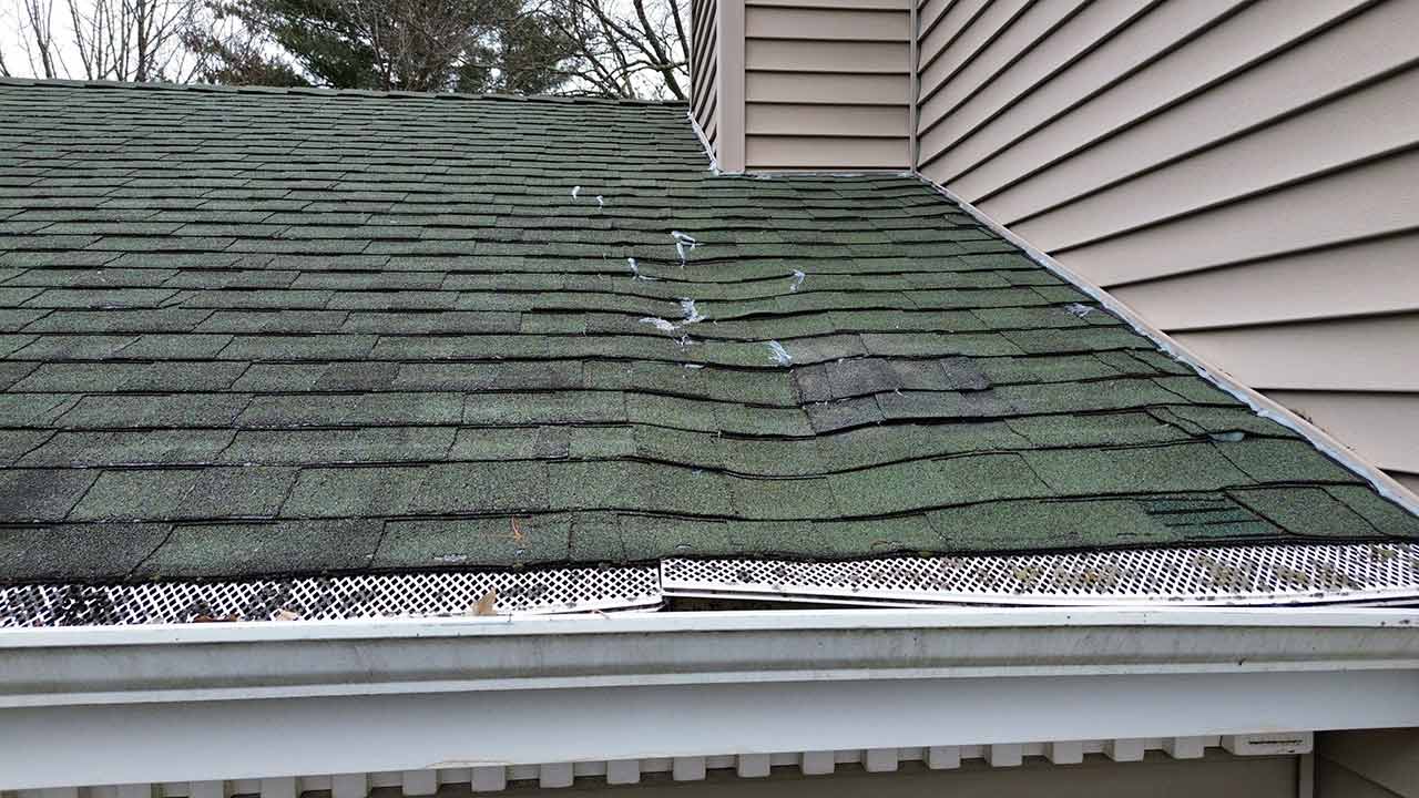 Warped shingles on roof