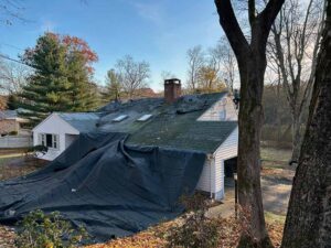 demo roof with tarp